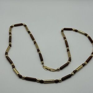 Elegant Vintage Gold and Brown Medal Necklace.  Has a Hallmark